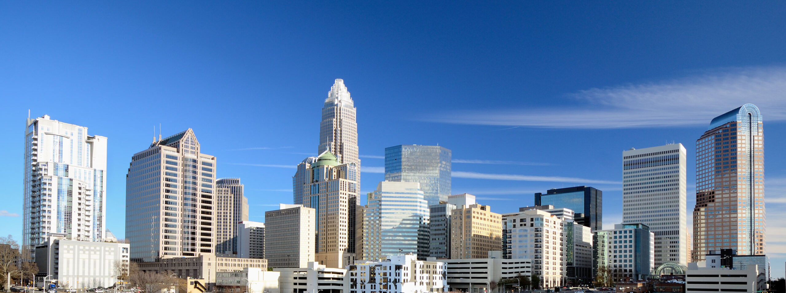 City skyline with modern skyscrapers under a clear blue sky.